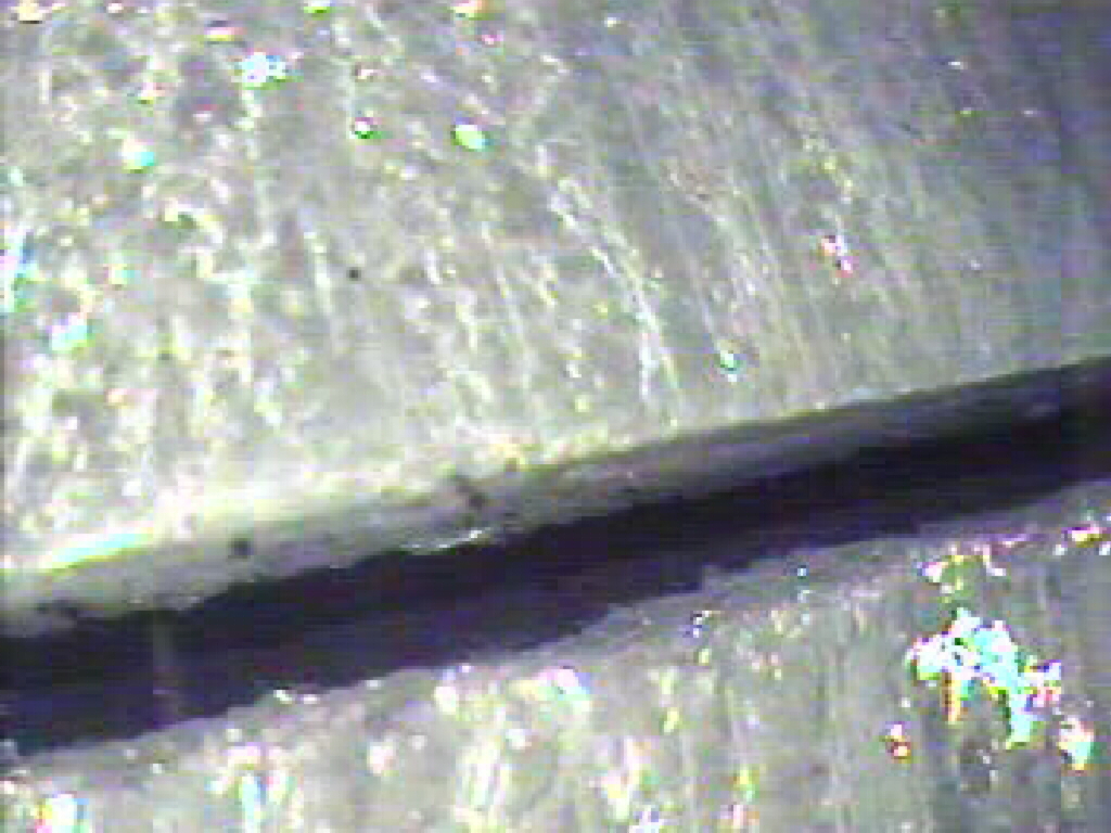Image of separation between two clay flue tiles as viewed with the video inspection camera.